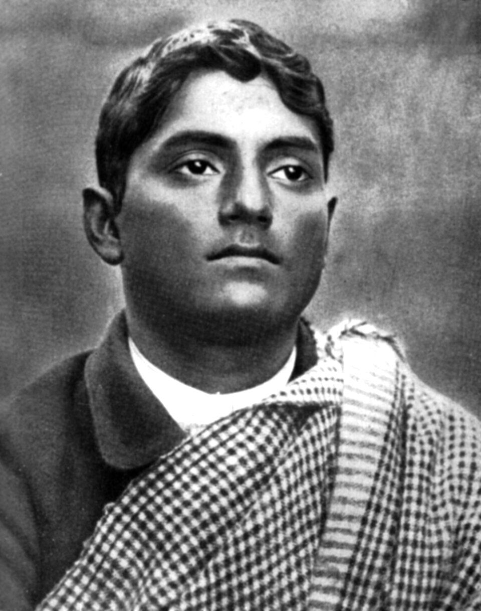 Portrait of Jatindranath Mukherjee wearing a checked shawl draped over one shoulder, facing the camera.