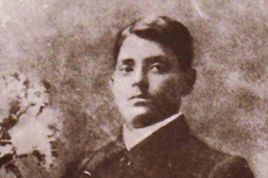Sepia photograph of Jatindranath Mukherjee as a young man, in a dark jacket with a high collar.